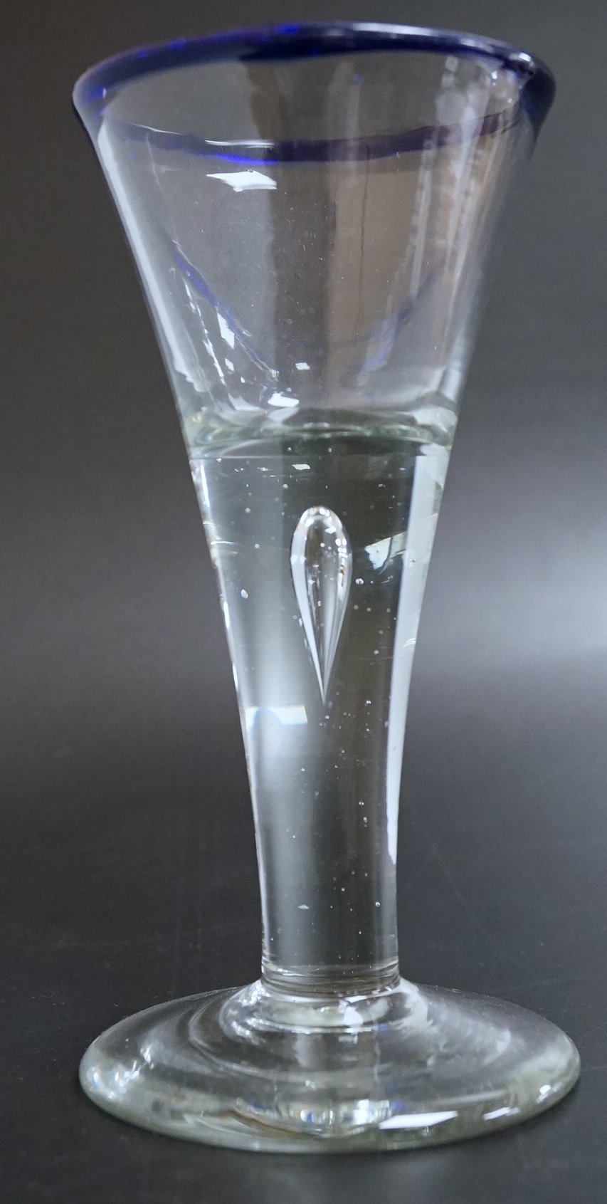 An 18th century blue rimmed wine glass, 16cm